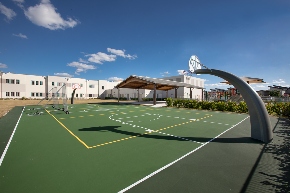 Architectural basketball field view of Andrea Castillo K8 school.